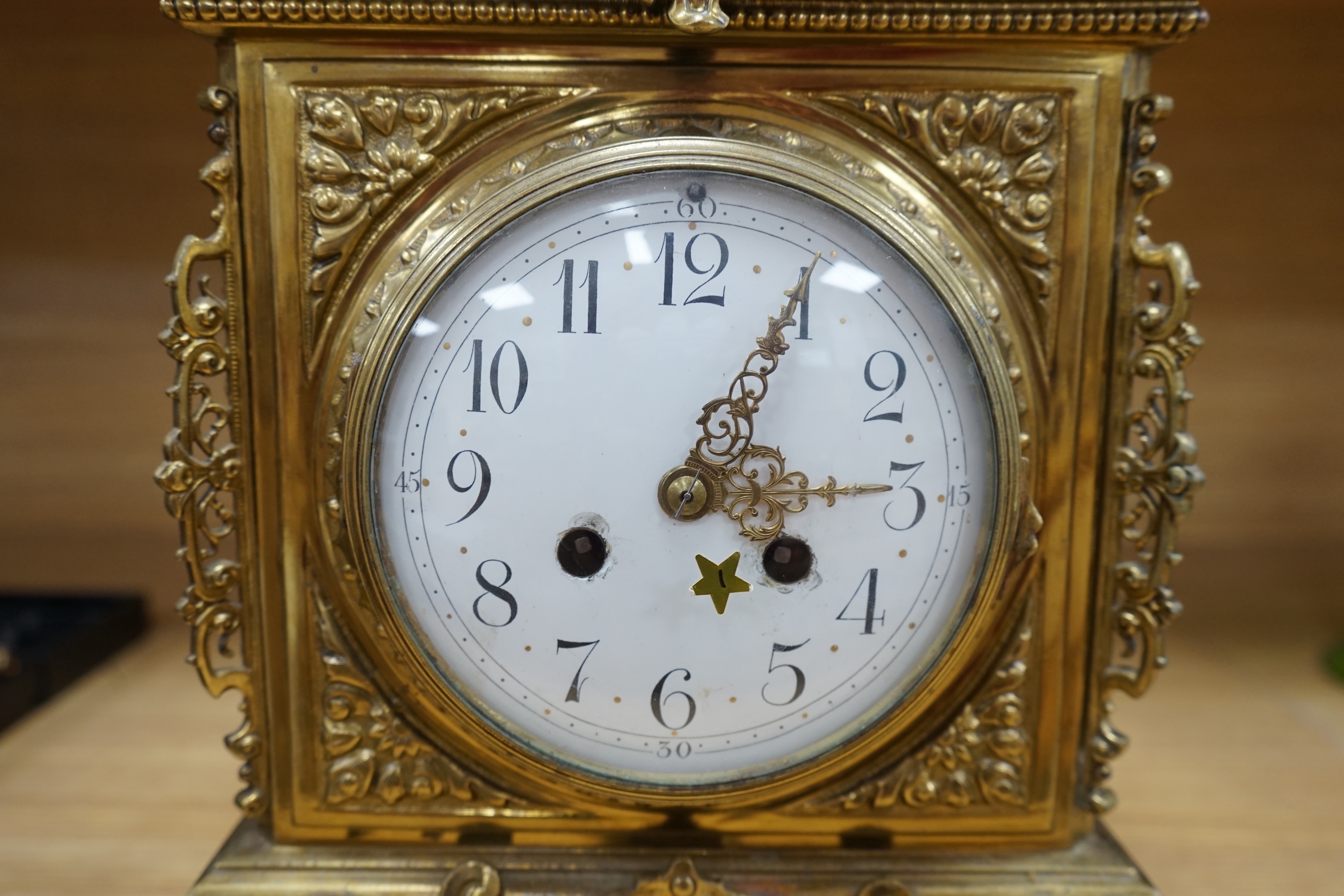 A Louis XVI style ormolu mantel clock with enamel dial, key and pendulum, 42cm. Condition - fair to good